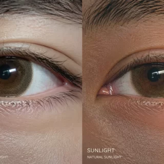Ultra-realistic split-screen comparison of a colored contact lens under harsh bathroom lighting versus natural ambient window light.